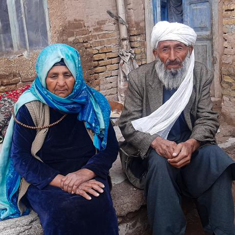 Abdul, 80, and Halima, 75, fled from Shindand District to Herat due to conflict and lack of food.