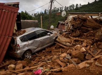 A home and a car destroyed by Cyclone Idai in Zimbabwe 